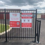 Storage Gate with Access Hours Sign